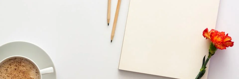 White table at home. Open empty sketchbook, wooden pencils Stock Photos