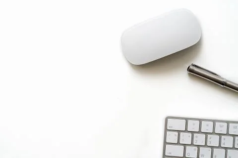 White Table with luxury pen, computer keyboard and mouse Stock Photos