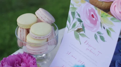 White table with sweets on nature. Wedding cakes and flowers. Sweet balls. Empty Stock Footage 61715218