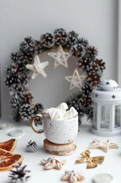 White table topped with a cup Stock Photos