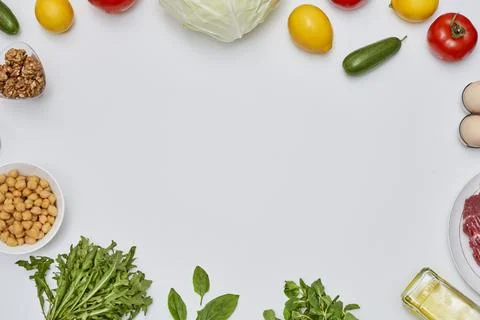 A white table topped with vegetables and other foods Stock Photos