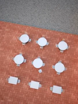 White tables and chairs of an empty pavement cafe, 3D Rendering Stock Illustration