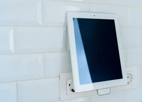 White tablet is charging Stock Photos