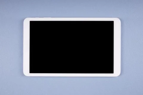 White tablet computer with blank screen on desk Stock Photos