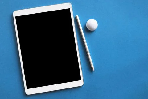 White tablet pencil blue surface. High quality and resolution beautiful photo Stock Photos