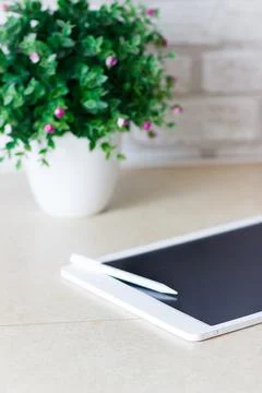 White tablet on the table Stock Photos
