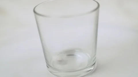 White Tablets Fall into a Glass Cup. Pharmaceutics and Medicines. Concept of Hea Stock-Footage 126225730