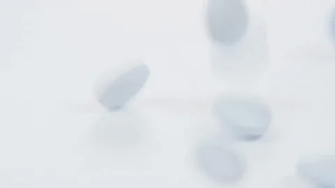 White Tablets Falling Down Stock Footage 69214716