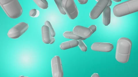 White tablets falling on a menthol background. Stock Footage 251875137