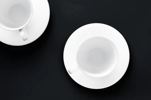 White tableware crockery set, empty cup on black flatlay background Stock Photos