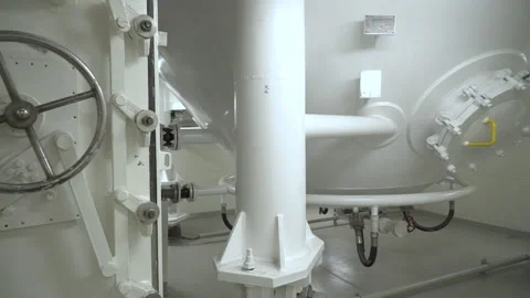 White tank inside room. Lower part of a large vertical tank. Stock Footage 266522013