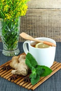 White tea mug with lemon, mint and ginger Stock Photos
