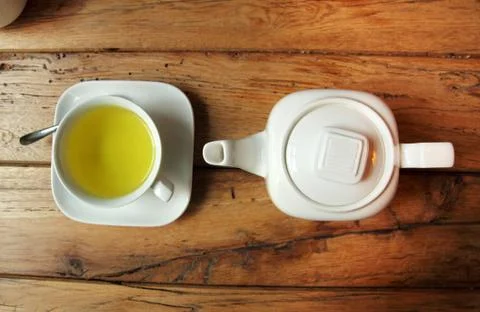White tea set on wooden table Stock Photos