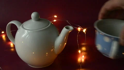 A white teapot and an additional porcelain cup Stock Footage 141121479