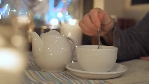 White teapot and cup on a  table  in city cafe. 動画素材 84655719