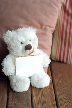 White teddy bear is holding envelope, your text Stock Photos