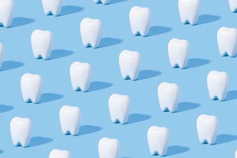 White teeth pattern on a blue paper background. Stock Photos