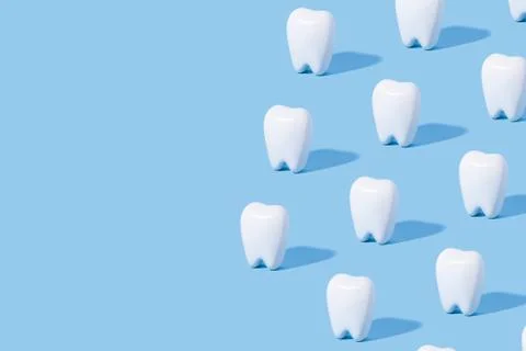 White teeth pattern on a blue paper background. Stock Photos