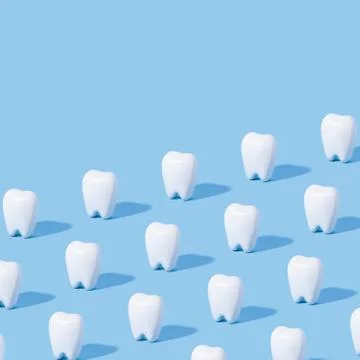 White teeth pattern on a blue paper background. Stock Photos