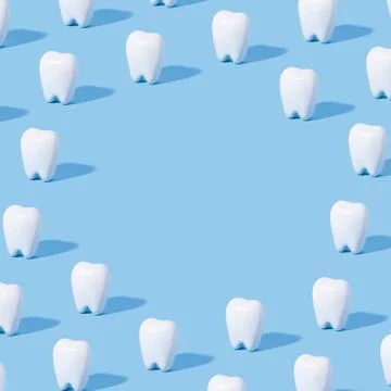 White teeth pattern on a blue paper background. Stock Photos