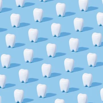 White teeth pattern on a blue paper background. Stock Photos