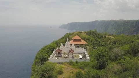 White temple on the top of the cliff with the cost on the background Stock Footage 101920069