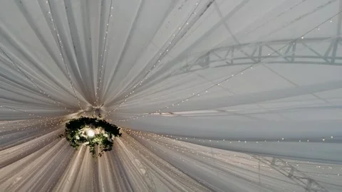 White tent ceiling during the day.The ceiling of the tent for banquets. Flowers, Stock Footage 253621100