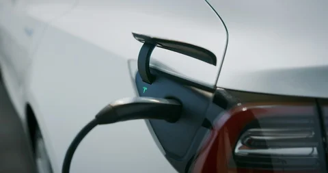 White Tesla Model 3 charging Stock Footage 103866989