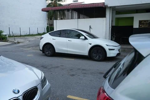 White Tesla Parked Stock Photos