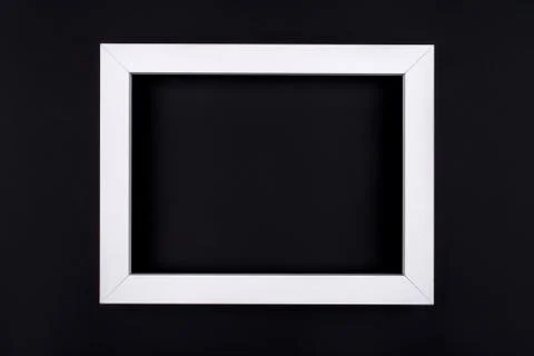 White text frame on a black background. Stock Photos