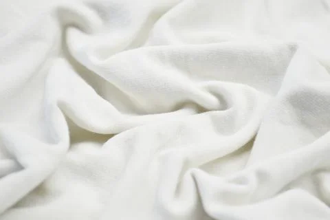 White textile pattern as a background. White material texture on fabric Stock Photos