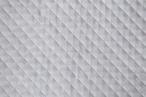 White textile texture with checkered mesh embossing. Abstract fabric pattern Stock Photos