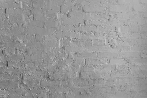 White textured plaster wall with rough brick pattern Stock Photos
