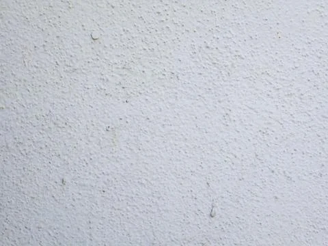 White textured plaster wall surface with subtle roughness Foto stock