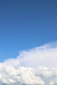 White thick clouds and blue sky background Stock Photos