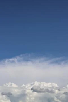 White thick clouds and blue sky background Stock Photos