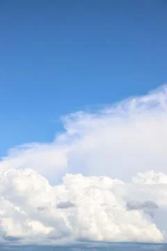 White thick clouds and blue sky background Stock Photos