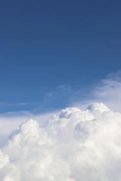 White thick clouds and blue sky background Stock Photos