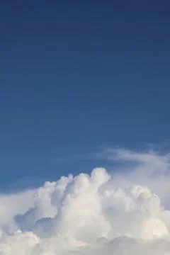White thick clouds and blue sky background Stock Photos