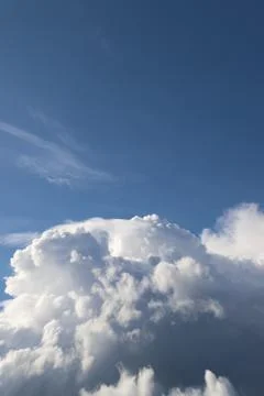 White thick clouds and blue sky background Stock Photos