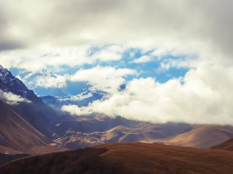 White thick clouds descended on the mountain peaks. Caucasian mountain range Stock Photos