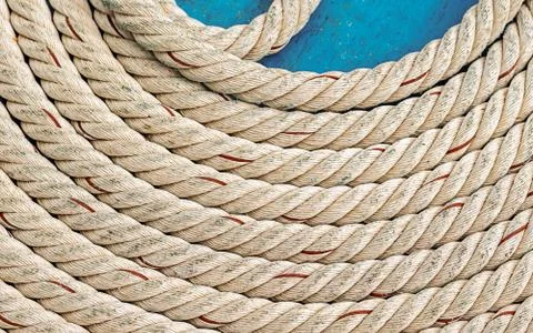 White thick rope circle part of a circle on a blue deck background marine 스톡 사진