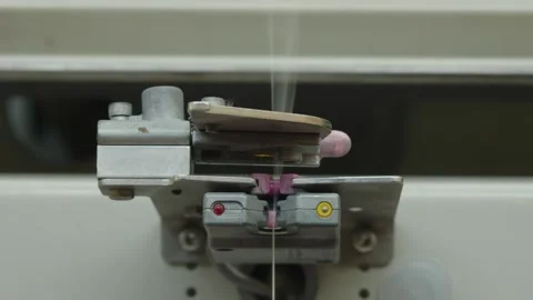 White thread braided in a factory spooling machine Stock Footage 291870571