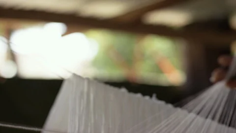 White thread in process of making cloth in handloom Stock Footage 107019609
