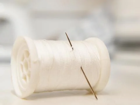 White thread on spool Stock Photos
