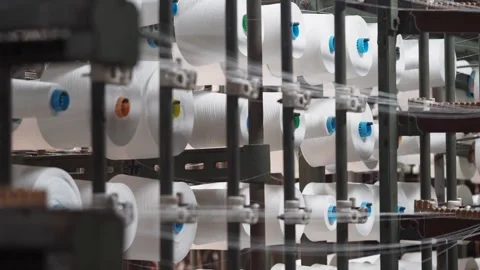 White Thread Spools on Industrial Machine in Production Line Close-Up Stock Footage 299946692