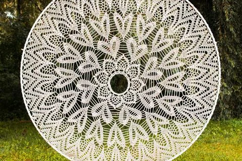 White threads knitting embroidered circle shape pattern folk garden natural e Stock Photos