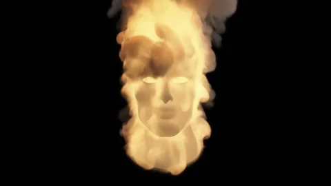 The white three-dimensional image of a human head is engulfed in flames and Stock Footage 170992222