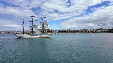 White three-masted tall ship sailing during Hanse Sail festival in Warnemunde. Stock Footage 342073747