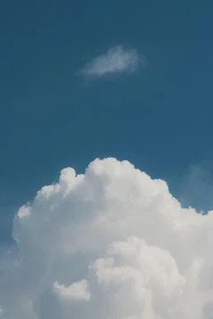 White thunderclouds in blue sky. summer cumulus clouds before rain. Beautiful Stock Photos